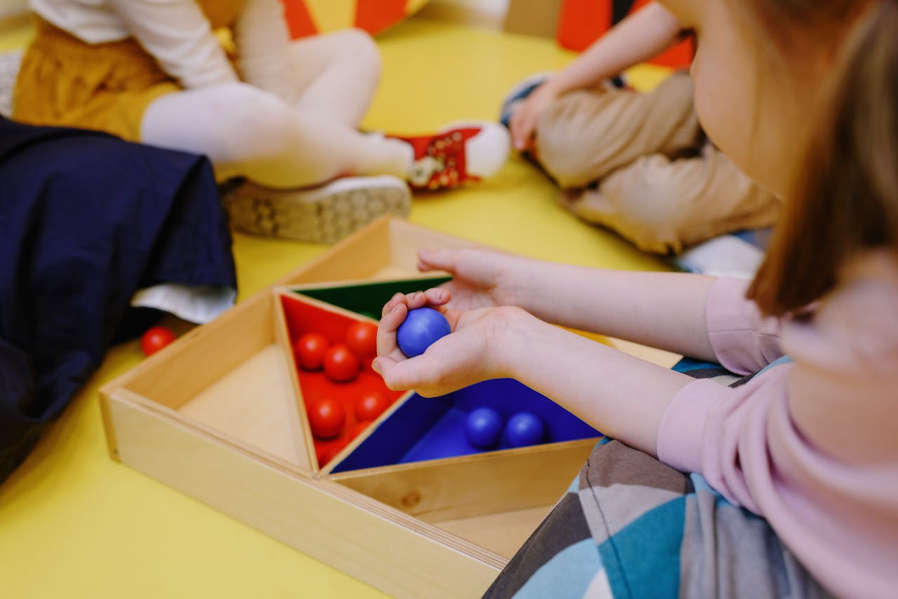 Children sorting colorful objects and learning shapes