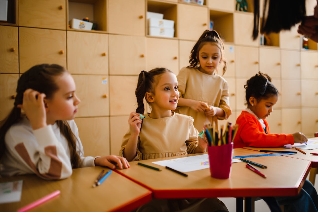 Children working together at classroom desks