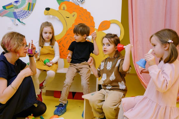 Child learning letters with an educator